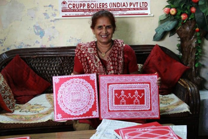 A Kumaoni Lady showing Aipan Art work